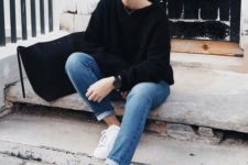 07 a black sweater, blue jeans, white sneakers and a black suede bag