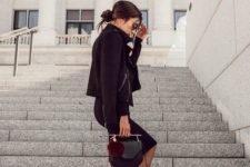 08 a black dress with a moto jacket, cale up heels and a cool geo bag