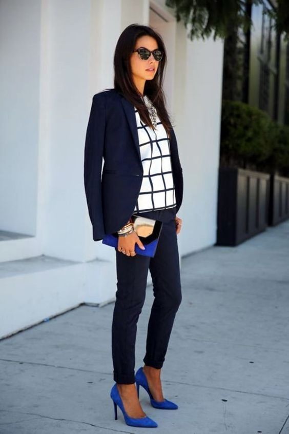 a navy suit with cropped pants, a window pane top, cobalt blue shoes and a clutch