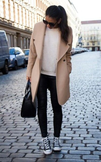 black leather pants, a white sweater, black chucks and a peachy knee coat