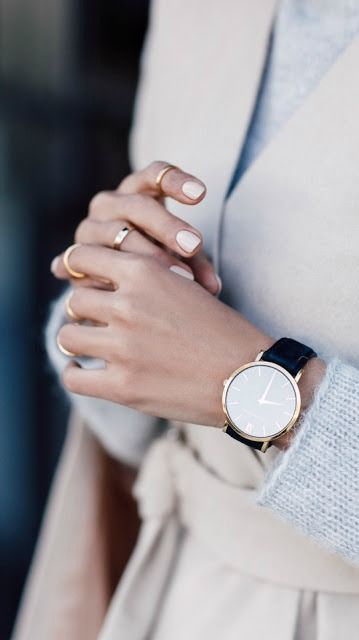 a gorgeous minimalist watch on a black leather band will fit many outfits