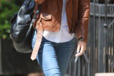 12 black flats, cropped blue jeans, a white shirt, a brown leather jacket and a black backpack