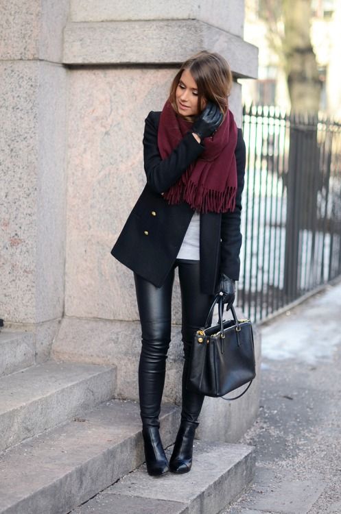 leather pants, black booties, a short black coat and a burgundy scarf