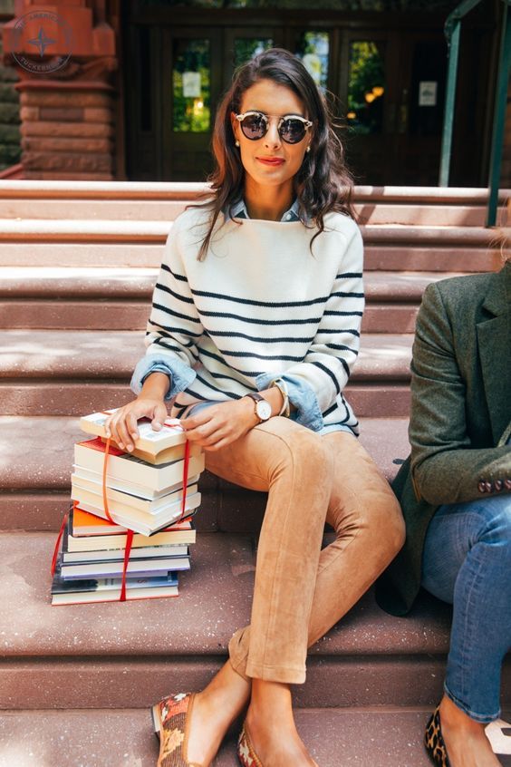 a chambray shirt, a striped sweater, orange velvet pants and flats