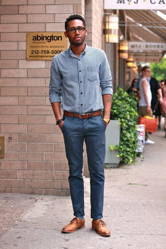 grey pants, a gingham shirt, brown shoes and a belt for a simple work outfit