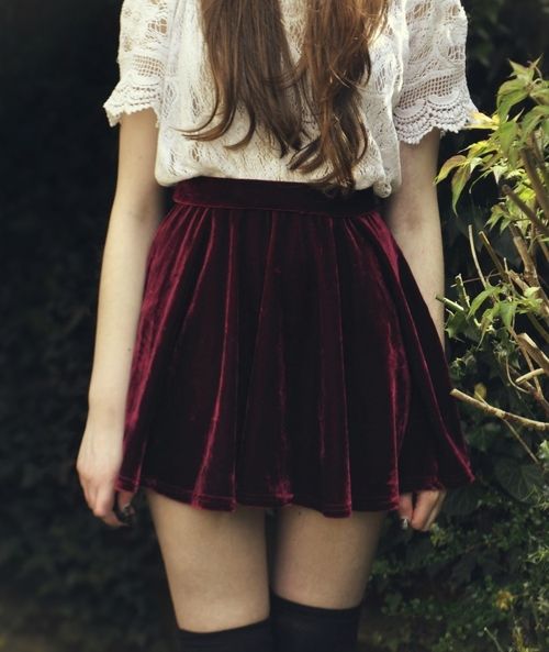 a white lace shirt, a maroon high waist velvet mini and black stockings