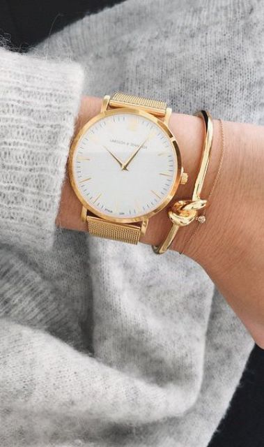 an elegant gold watch with gold bracelets for a super elegant and luxurious look