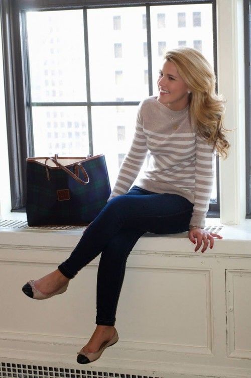 a neutral striped sweater, navy jeans and beife and black flats to feel comfy
