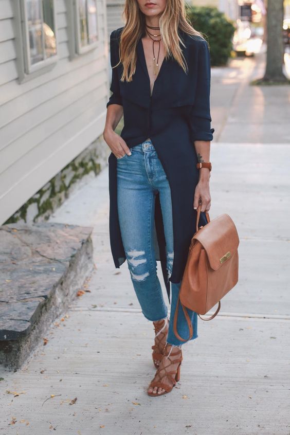 ripped cropper blue jeans, a black long shirt, brown lace up heels and a matching backpack