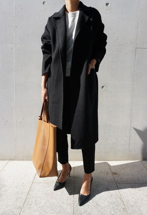a work look with cropped black pants, a white top, black heels and a black coat