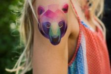 Adorable bear head tattoo on the shoulder