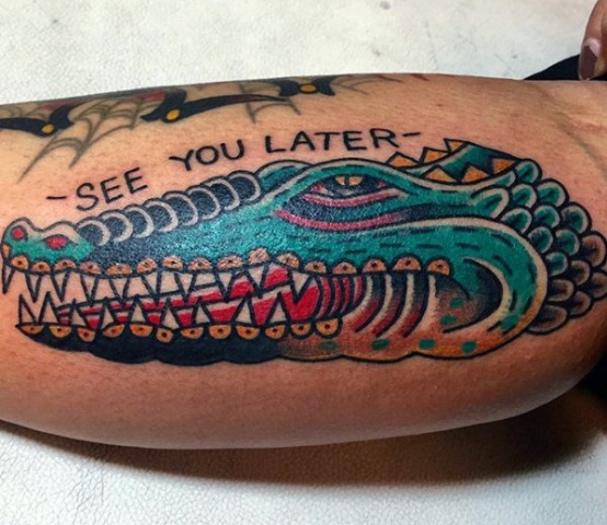 Alligator with message tattoo