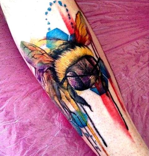 Awesome colored honey bee tattoo on the leg