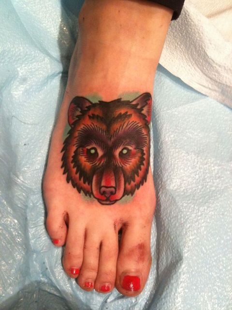 Bear tattoo on the foot