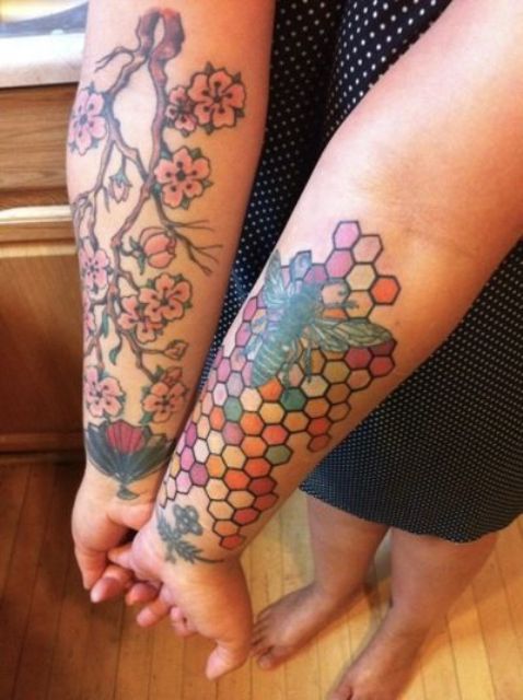 Bee and honeycombs tattoo on the arm