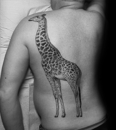 Big giraffe tattoo on the back