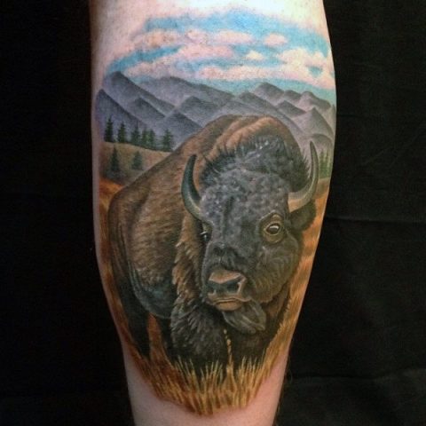 Bison and fields tattoo on the leg