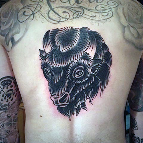 Bison head tattoo on the back