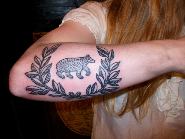 Black bear tattoo on the arm