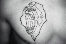 Black-contour angry monkey tattoo