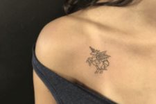 Black-contour tattoo on the shoulder