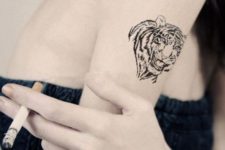 Black tiger tattoo on the arm