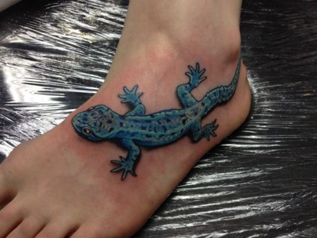 Blue lizard tattoo idea on the foot