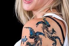 Blue phoenix tattoos on the shoulder
