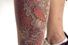 Carp fish tattoo on the leg