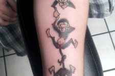 Cartoon monkeys tattoo on the arm