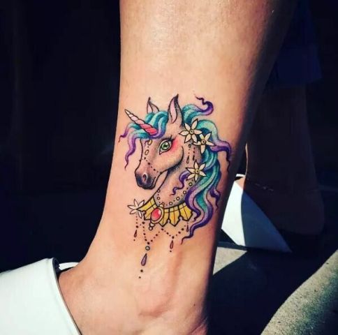 Cartoon unicorn tattoo on the ankle