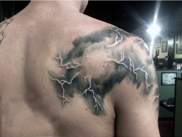 Cloud and lightning tattoo on the shoulder