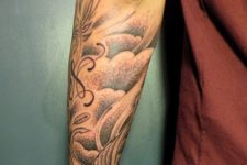 Cloud tattoo on the forearm