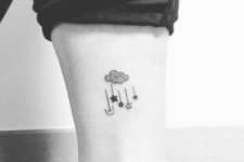 Cloud with falling stars tattoo on the leg
