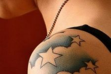 Clouds with stars tattoo on the shoulder
