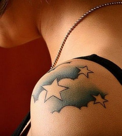 Clouds with stars tattoo on the shoulder