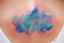 Colorful cloud tattoo on the back