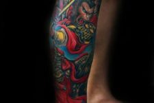 Colorful monkey king tattoo on the leg
