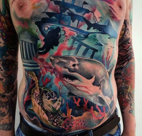 Colorful shark tattoo on the stomach