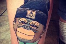 Cool monkey with a hat tattoo