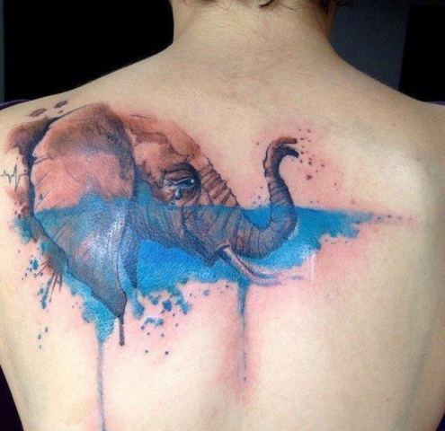 Crying elephant tattoo on the back