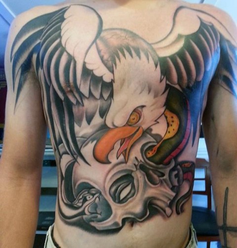 Eagle and scull tattoo on the chest and stomach