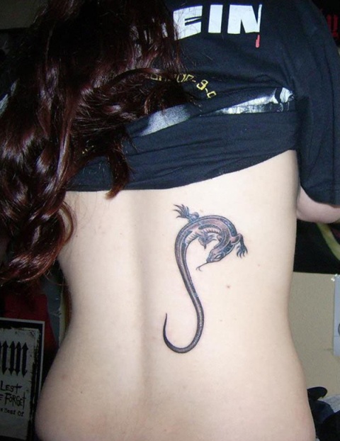 Elegant lizard tattoo on the back