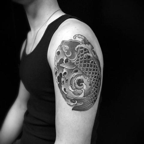 Fish and water tattoo on the arm