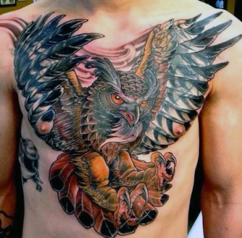 Flying owl tattoo on the chest