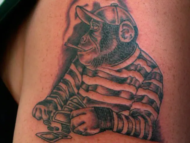 Funny monkey tattoo on the hand
