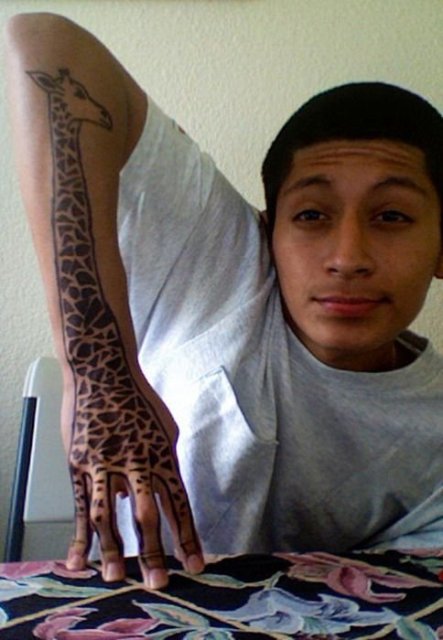 Giraffe tattoo on the arm