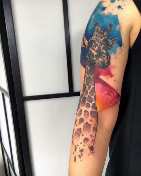 Giraffe tattoo with red and blue splashes