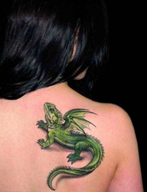 Gorgeous green lizard tattoo on the back