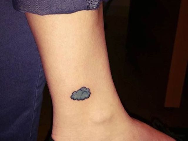 Gray cloud tattoo on the ankle